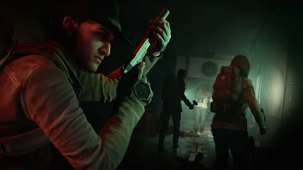 Official No More Room in Hell 2 screenshot showing a responder holding a firearm in a dark hallway